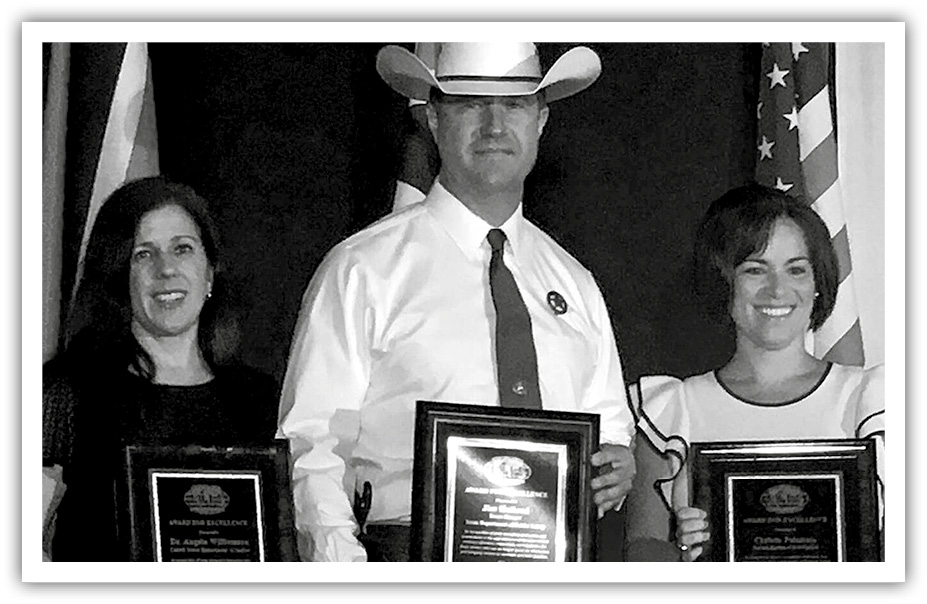 A photo of Dr. Angela Williamson, FBI Crime Analyst Christie Palazzolo, and Texas Ranger James Holland awarded for their meticulous and groundbreaking work.