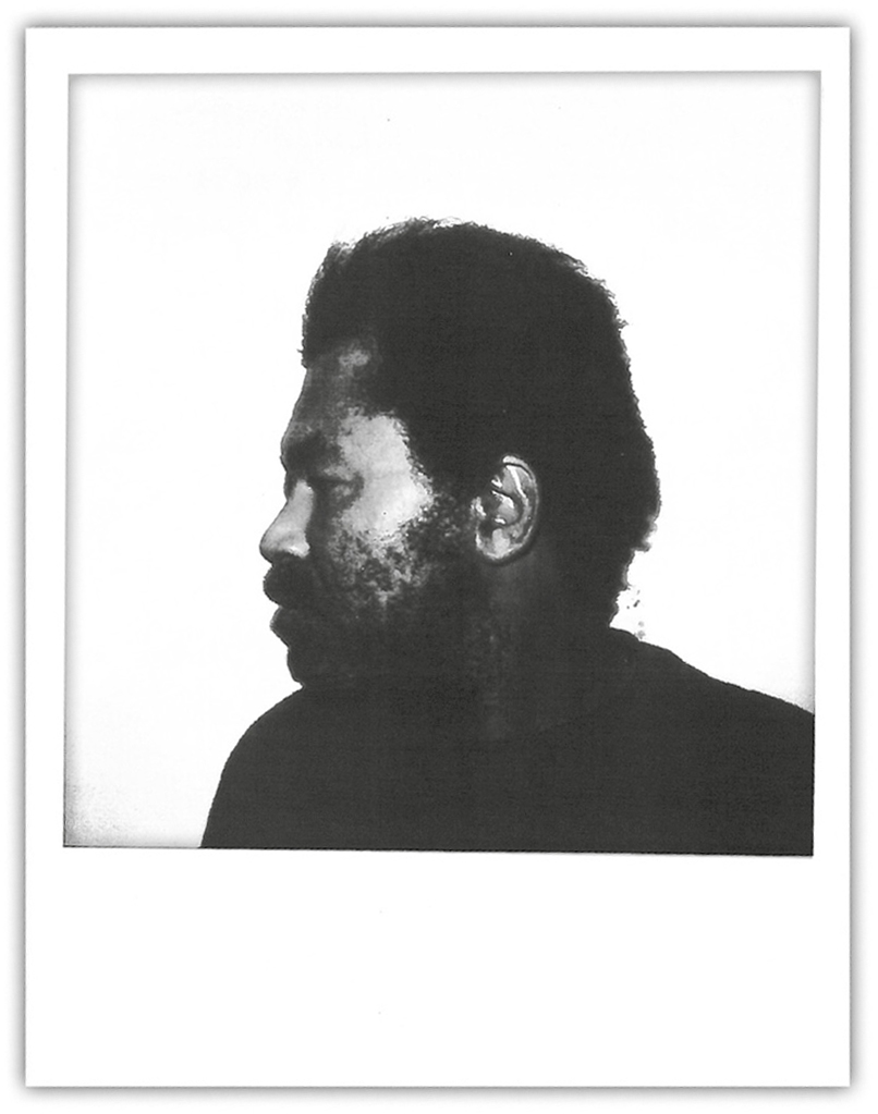 A polaroid photo of the side of Samuel Little's face.