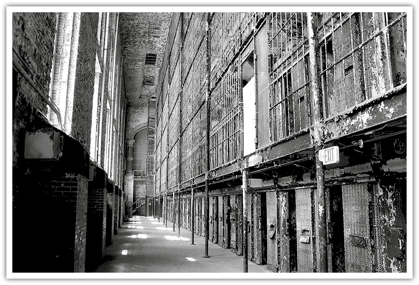A photo of the Ohio State Reformatory. Many cells with barred walls are in view.